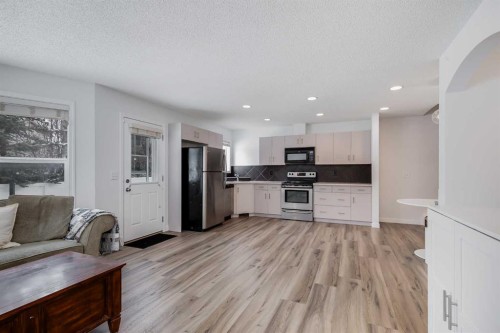 2 Everridge Villas Sw, Calgary, AB - Indoor Photo Showing Kitchen With Double Sink