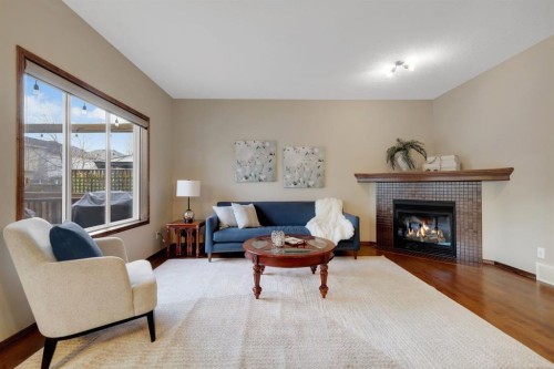 184 Brightondale Parade Se, Calgary, AB - Indoor Photo Showing Living Room With Fireplace