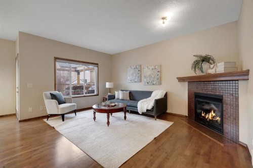 184 Brightondale Parade Se, Calgary, AB - Indoor Photo Showing Living Room With Fireplace