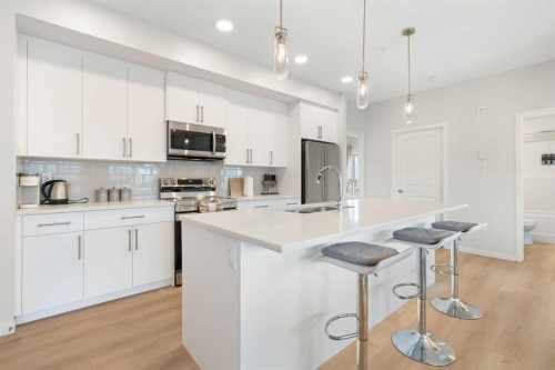 6412-20295 Seton Way Se, Calgary, AB - Indoor Photo Showing Kitchen With Stainless Steel Kitchen With Double Sink With Upgraded Kitchen