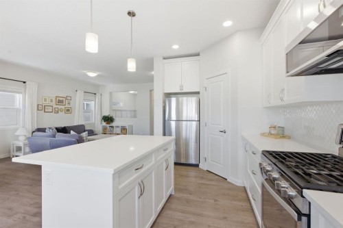316 Sundown View, Cochrane, AB - Indoor Photo Showing Kitchen With Stainless Steel Kitchen With Upgraded Kitchen