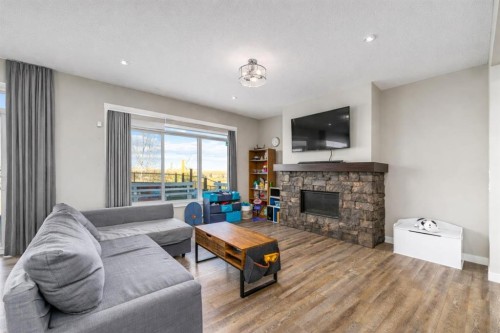 125 Sage Bluff Close Nw, Calgary, AB - Indoor Photo Showing Living Room With Fireplace