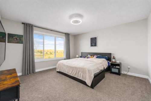 125 Sage Bluff Close Nw, Calgary, AB - Indoor Photo Showing Bedroom