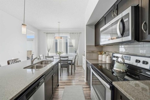 189 Mahogany Drive, Calgary, AB - Indoor Photo Showing Kitchen With Stainless Steel Kitchen With Double Sink With Upgraded Kitchen