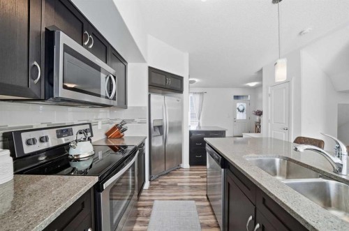 189 Mahogany Drive, Calgary, AB - Indoor Photo Showing Kitchen With Stainless Steel Kitchen With Double Sink With Upgraded Kitchen