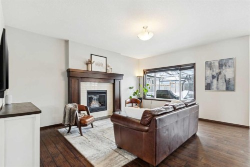 69 Elgin Meadows Manor Se, Calgary, AB - Indoor Photo Showing Living Room With Fireplace