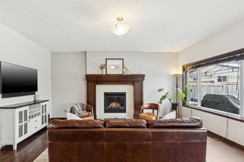 69 Elgin Meadows Manor Se, Calgary, AB - Indoor Photo Showing Living Room With Fireplace