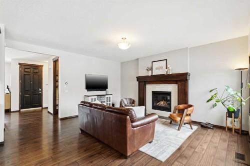 69 Elgin Meadows Manor Se, Calgary, AB - Indoor Photo Showing Living Room With Fireplace