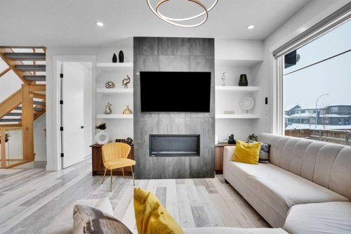 103 Sandpiper Park, Chestermere, AB - Indoor Photo Showing Living Room With Fireplace