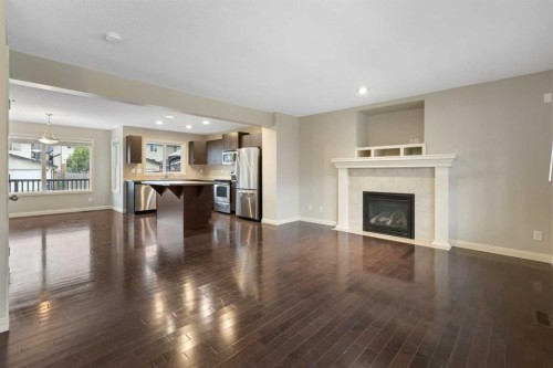 221 Prestwick Terrace Se, Calgary, AB - Indoor Photo Showing Living Room With Fireplace