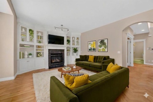 3 Hampstead Hill Nw, Calgary, AB - Indoor Photo Showing Living Room With Fireplace