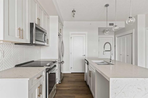 407-300 Auburn Meadows Common Se, Calgary, AB - Indoor Photo Showing Kitchen With Stainless Steel Kitchen With Double Sink With Upgraded Kitchen