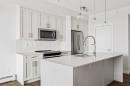 407-300 Auburn Meadows Common Se, Calgary, AB  - Indoor Photo Showing Kitchen With Upgraded Kitchen 