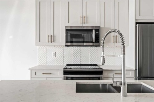 407-300 Auburn Meadows Common Se, Calgary, AB - Indoor Photo Showing Kitchen With Stainless Steel Kitchen With Double Sink With Upgraded Kitchen