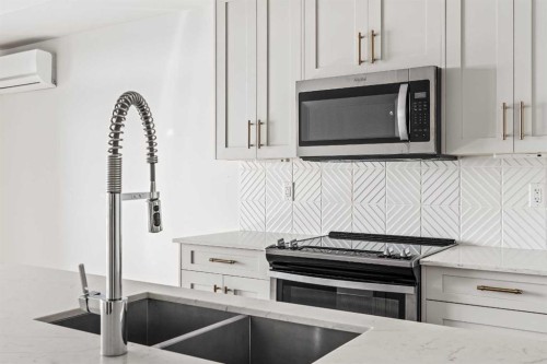 407-300 Auburn Meadows Common Se, Calgary, AB - Indoor Photo Showing Kitchen With Double Sink With Upgraded Kitchen