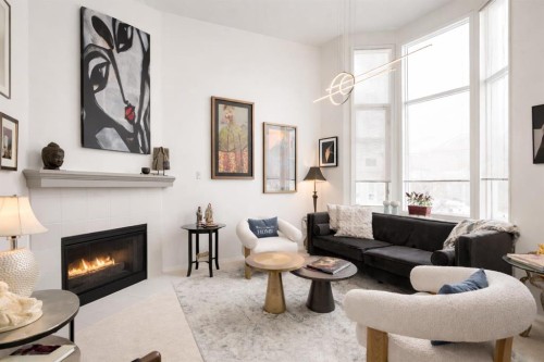318 Hawkstone Manor Nw, Calgary, AB - Indoor Photo Showing Living Room With Fireplace