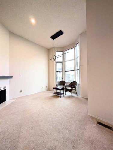 318 Hawkstone Manor Nw, Calgary, AB - Indoor With Fireplace