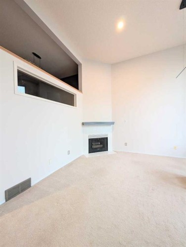 318 Hawkstone Manor Nw, Calgary, AB - Indoor With Fireplace