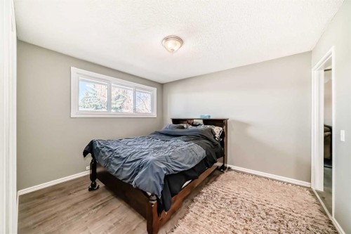 148 Huntridge Road Ne, Calgary, AB - Indoor Photo Showing Bedroom