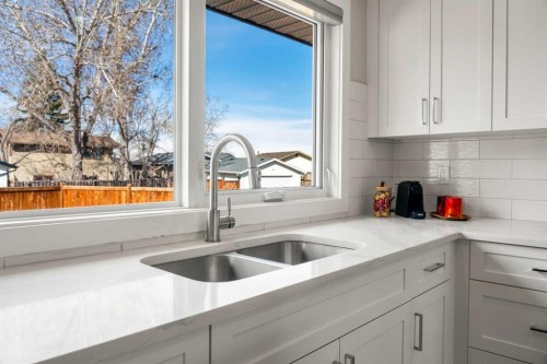 16 Midcrest Rise Se, Calgary, AB - Indoor Photo Showing Kitchen With Double Sink