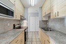 103-231 64 Avenue Nw, Calgary, AB  - Indoor Photo Showing Kitchen With Double Sink With Upgraded Kitchen 