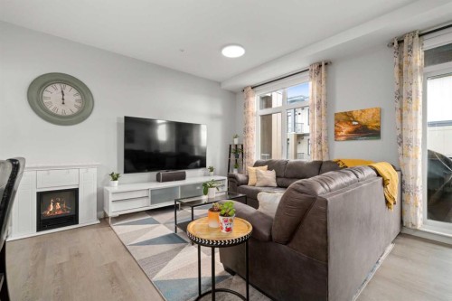 4314-200 Seton Circle Se, Calgary, AB - Indoor Photo Showing Living Room With Fireplace