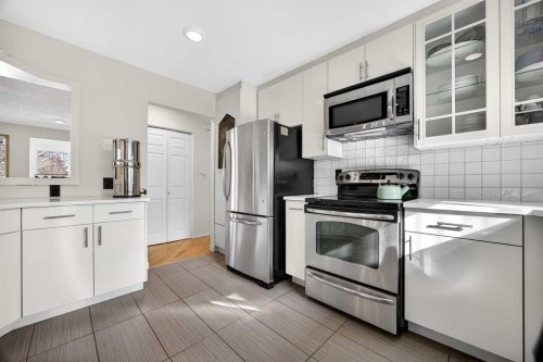 100 Strathcona Close Sw, Calgary, AB - Indoor Photo Showing Kitchen With Stainless Steel Kitchen