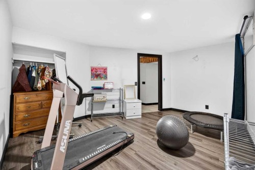 100 Strathcona Close Sw, Calgary, AB - Indoor Photo Showing Gym Room