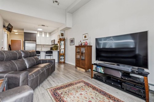 1402-95 Burma Star Road Sw, Calgary, AB - Indoor Photo Showing Living Room