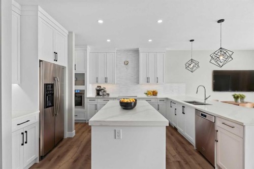 160 Vantage Drive, Cochrane, AB - Indoor Photo Showing Kitchen With Double Sink With Upgraded Kitchen