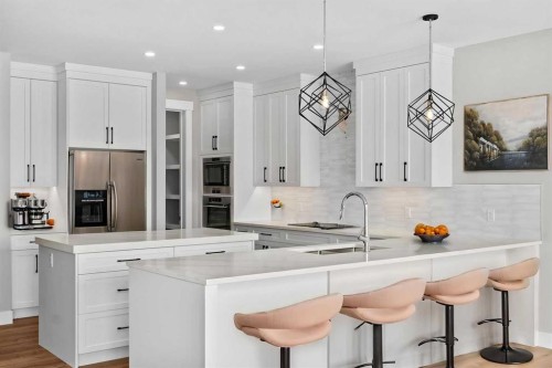 160 Vantage Drive, Cochrane, AB - Indoor Photo Showing Kitchen With Upgraded Kitchen