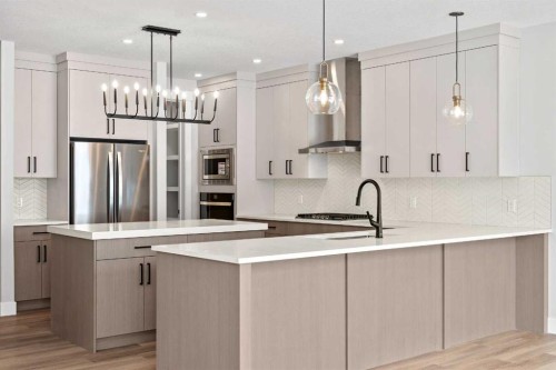 157 Vantage Drive, Cochrane, AB - Indoor Photo Showing Kitchen With Upgraded Kitchen