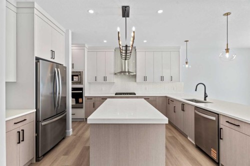 157 Vantage Drive, Cochrane, AB - Indoor Photo Showing Kitchen With Upgraded Kitchen