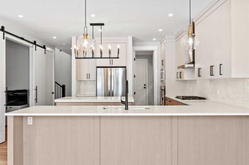 157 Vantage Drive, Cochrane, AB - Indoor Photo Showing Kitchen With Upgraded Kitchen