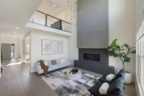 17 Sunvalley View, Cochrane, AB - Indoor Photo Showing Living Room With Fireplace