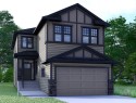 68 Vantage Drive, Cochrane, AB  - Outdoor With Facade 
