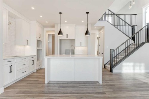 68 Vantage Drive, Cochrane, AB - Indoor Photo Showing Kitchen With Upgraded Kitchen