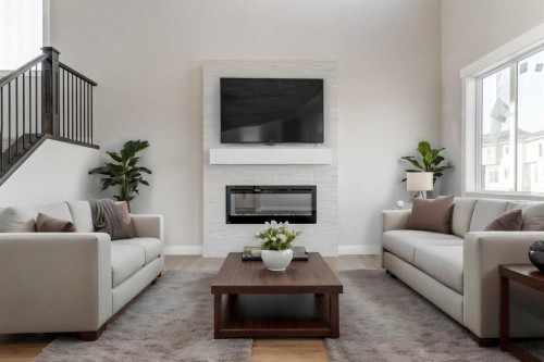 68 Vantage Drive, Cochrane, AB - Indoor Photo Showing Living Room With Fireplace
