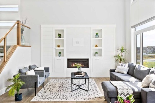 16 Sunvalley View, Cochrane, AB - Indoor Photo Showing Living Room With Fireplace