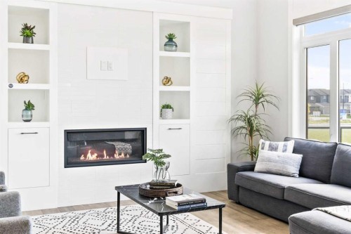 16 Sunvalley View, Cochrane, AB - Indoor Photo Showing Living Room With Fireplace