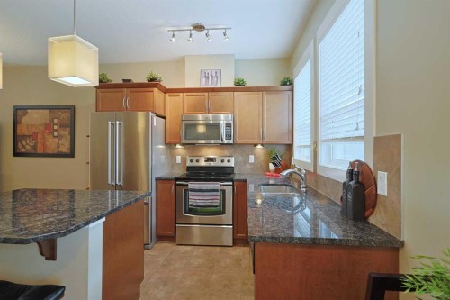 505 Evanston Square Nw, Calgary, AB - Indoor Photo Showing Kitchen With Stainless Steel Kitchen With Double Sink