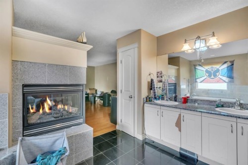 35 Cranleigh Drive Se, Calgary, AB - Indoor Photo Showing Living Room With Fireplace
