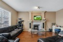 35 Cranleigh Drive Se, Calgary, AB  - Indoor Photo Showing Living Room With Fireplace 