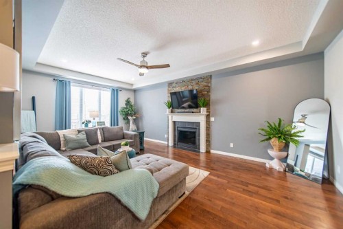 322 Windridge View Sw, Airdrie, AB - Indoor Photo Showing Living Room With Fireplace