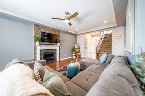 322 Windridge View Sw, Airdrie, AB - Indoor Photo Showing Living Room With Fireplace