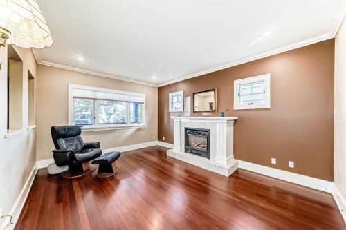 452 13 Street Nw, Calgary, AB - Indoor Photo Showing Living Room With Fireplace