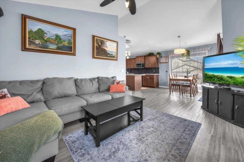 301 Mcleod Crescent, Diamond Valley, AB - Indoor Photo Showing Living Room