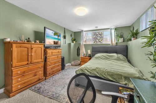 301 Mcleod Crescent, Diamond Valley, AB - Indoor Photo Showing Bedroom