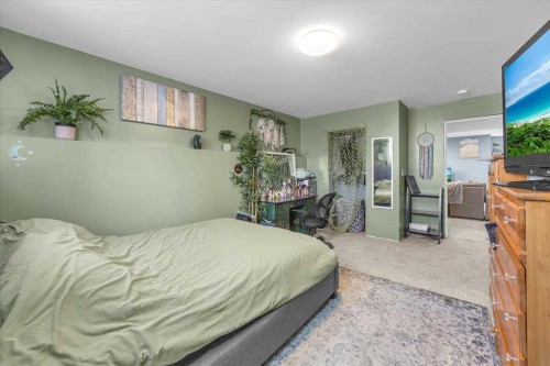 301 Mcleod Crescent, Diamond Valley, AB - Indoor Photo Showing Bedroom