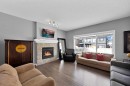 629 Marina Drive, Chestermere, AB  - Indoor Photo Showing Living Room With Fireplace 